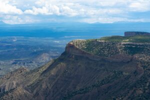 Explore the stunning aerial view of the majestic Mesa Verde cliffs in Colorado, showcasing nature's beauty.
